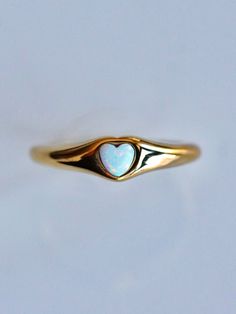 Perfect for every day, every look, and every aesthetic, the Opal Signet Ring is the perfect piece for any ring collection! The classic signet style is updated with a touch of Serendipity magic with a mesmerizing yet dainty opal heart taking center stage. Understated yet eye-catching, the opal signet ring is perfect for any stacked ring look or as a stand alone stunner. 💕 Don't know your ring size? View our Ring Size Guide …………………………………. RING SIZE & MATERIAL❋ water resistant 14k gold plated stai Signet Ring Aesthetic, Opal Heart Ring, Pinky Signet Ring, Every Aesthetic, Gold Signet Ring, Ring Collection, Waterproof Jewelry, Everyday Rings, Jewelry Lookbook