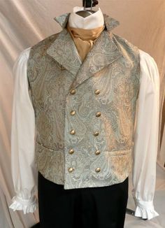 Our very popular English Regency Double Breasted Waistcoat buttons high on the chest, perfect for showcasing a crisp linen shirt and beautiful silk cravat. A special feature of my vests is that the back is made of the same fancy fabric as the front, not just a lining fabric. You choice of buttons:  matte gold, antiqued gold or made of self fabric to match. Plus one extra - just in case! 2 functioning hip pockets, and an adjustable back belt that creates a custom fit for you This is a custom made Fitted Gold Vest Elegant Style, Fitted Gold Elegant Vest, Gold Fitted Vest, Elegant Gold Fitted Vest, Fitted Wedding Vest With Buttons, Fitted Vest With Buttons For Wedding, Sleeveless Vest With Buttons For Wedding, Elegant Wedding Vest With Buttons, Classic Nehru Jacket For Wedding