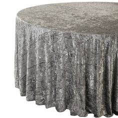 a round table covered in silver crushed velvet