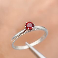 The Garnet Ring For Women is made from natural garnet gemstone. This is a perfect gift for her if you are looking for a January Birthstone Ring, a Simple Promise Ring, a Ring For Girlfriend, a Red Stone Ring, or a Red Crystal Ring. A garnet ring is a beautiful piece of jewelry that will make you feel special and your loved ones feel special. It is the best gift for anyone. ✧ Why should buy this ring: - The handmade garnet ring is meticulously designed and handcrafted from natural stone and s925 solid silver. - This is a ring of friendship and love. The natural garnet stone symbolizes the power of the sun and the earth, bringing light and warmth to your life. ✧ Occasion: - A garnet ring is an ideal gift for anyone who has a birthday coming up. It is also a great gift to give your mother on Simple Promise Ring, Red Crystal Ring, Ring For Girlfriend, Promise Rings Simple, January Birthstone Rings, Red Stone Ring, Zierlicher Ring, January Birthstone, Garnet Ring