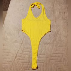 Brand New! Casual Halter Neck Bodysuit For Beach Season, Casual Halter Neck Bodysuit For Party, Casual Halter Neck Bodysuit For Vacation, Casual Summer Bodysuit With Halter Neck, Summer Casual Halter Neck Bodysuit, Chic Yellow Sleeveless Bodysuit, Summer Halter Neck Bodysuit In Solid Color, Halter Neck Bodysuit For Summer, Summer Solid Color Halter Neck Bodysuit