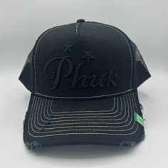 PHUK HUMBLE UNISEX TRUCKER HAT. DISTRESSED BRIM AND EMBROIDERED FRONT ART. WOVEN TAG AT BRIM + ADJUSTABLE BACK. Fabric: 100% Cotton / Mesh: 100% Nylon TAC350-000-001 Streetwear Trucker Hat With Short Brim And Embroidered Logo, Streetwear Trucker Hat With Embroidered Logo And Short Brim, Casual Trucker Hat With Short Brim And Embroidered Logo, Casual Trucker Hat With Embroidered Logo And Short Brim, Trucker Hat, Mesh, Hats, Fabric, Black