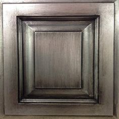 a close up view of a square metal cabinet door