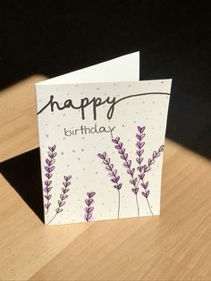 a birthday card sitting on top of a wooden table