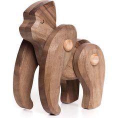 a wooden toy that is shaped like an elephant and has two smaller elephants on it's legs