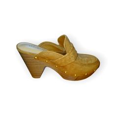 Slip On Style. Moc Toe Silhouette. Woven Detailing On Strap. Stud Detailing On Trim. Chunky Stacked Heel. Textile Upper. Man-Made Lining, Insole And Outsole Heel Height: 4 In Weight: 10 Oz Platform Height: 1 14 In Chic Spring Clogs With 4-inch Heel, Casual Closed Toe Platform Heels, Spring Clogs With 4-inch Wedge Heel, Spring Slip-on Heels With Round Toe, Trendy Suede Sandals With Round Toe, Chic Clogs With 4-inch Heel And Round Toe, Elegant Clogs With Cushioned Footbed And Round Toe, Suede Platform Mules With Round Toe, Elegant Cushioned Clogs With Round Toe