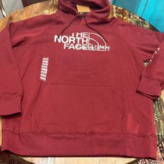 Maroon North Face Hoodie With Silver Logo On The Front And Lettering The Sleeve. Drawstring Hood And Front Pouch Pocket. The North Face Fleece Crew Neck Sweatshirt, The North Face Sweatshirt For Streetwear In Fall, The North Face Sweatshirt For Fall Streetwear, The North Face Fall Streetwear Sweatshirt, The North Face Crew Neck Sweatshirt For Outdoor, Fleece Hoodie By The North Face For Fall, The North Face Long Sleeve Sweatshirt For Fall, Fall Fleece Hoodie By The North Face, Casual The North Face Fleece Sweatshirt