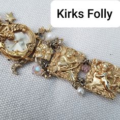 Super Gorgeous Very Rare Kirks Folly Watch With 4 Intricately Carved And Decorated Chunky Gold Plated Cherubim Angels Connected Bracelet . An Absolute Stunner Statement Piece. A Collector's Showpiece If You're A Fan! Length 7.7" Unclasped Width 1.2" Amazing Vintage Condition Watch Needs New Batteries $225 Firm Cherubim Angels, Kirks Folly Jewelry, Kirks Folly, Very Rare, Womens Jewelry Bracelets, Batteries, Bracelet Watch, Gold Plate, Women Jewelry