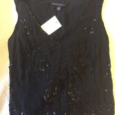 Holiday Sequin Top. Black With Silver Sequins. Sleeveless. Scalloped Bottom. Art Deco Style. Delicate, Vintage. In Excellent Condition. Comes With A Packet Of Extra Sequins. These Pics Do Not Do This Special Top Justice. Can Go With The Matching Skirt. Glamorous Black Tank Top For Evening, Glamorous Black Evening Tank Top, Glamorous Embellished Black Tank Top, Glamorous Black Embellished Tank Top, Black Sequin Tank Top For Evening, Black Sleeveless Top For Party Season, Glamorous Evening Vest For Summer, Embellished Black Tank Top For Night Out, Elegant Sequined Tank Top