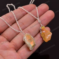 *Stone Name : Natural Raw Opal *Stone Color : As Seen As Picture *Size : Approx 15 to 25mm *Quantity : 1 Pendant Necklace *Shape : Rough *Country Of Origin : Ethiopia *Quality : AA+ *Gemstone Type : Natural *Healing : Opal has a generally health enhancing effect because it strengthens the will to live. Opal is beneficial for the health or your eyes, kidneys and skin. This stone is helpful if you are challenged by dehydration or water retention. Use it to balance your body's water content. *Penda Amber Sterling Silver Necklace For Healing, Citrine Healing Jewelry With Stones, Sterling Silver Pendant Crystal Necklace With Stones, Sterling Silver Pendant Necklace With Raw Stone, Sterling Silver Jewelry With Large Amber Stone, Sterling Silver Amber Jewelry With Large Stone, Sterling Silver Pendant With Raw Stone, Silver Necklace With Large Mineral Crystal Stone, Silver Necklace With Mineral Crystal Stones