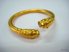 "Ethnic Traditional design gold vermeil gold gilded silver Bracelet or Bangle from Rajasthan India. This Bangle has been made in Rajasthan by Expert local silversmith, it is handmade and has very nice traditional look. Very Easy to wear by little twiest. weight - 24 grams Inner Diameter - 5.9 cm (2.3\") Inner circumference - 18.5 cm (7.28\") Outer diameter - 7.3 cm (2.87\") width - 0.8 cm material - Good silver with gold plate." Unique Gold Cuff Bracelet With Intricate Design, Yellow Gold Bracelet Jewelry For Rituals, Unique Yellow Gold Bracelets For Ceremonial Occasions, Yellow Gold Rituals Bracelet Jewelry, Yellow Gold Ritual Bracelet Jewelry, Unique Yellow Gold Bangle Bracelet, Gold Bangle For Formal Occasions, Gold Spiritual Bangle For Formal Occasions, Unique Yellow Gold Bangle For Wedding