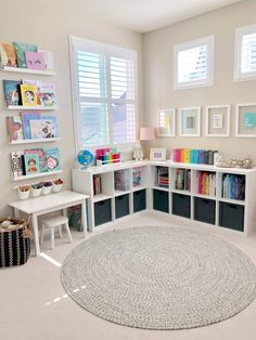 a white room with lots of books and toys