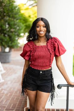 Perfectly girly in this Tandy Top. Cropped and cute. Tandy features shoulder ruffle and puff sleeve, smocked bodice that provides great stretch, and a cropped length. We would style her with our John Skort and Boots for gameday! Product Details: Fit: The Tandy Top fits true to size Length: Cropped length. The small measures 12.5" from shoulder to hem Bust: Not fitted- smocking allows for good stretch. Bra friendly. Waist: Relaxed fit Fabric: The fabric doesn't contain stretch Material: 100% Rayo Heading Fonts, Boho Shirts, Top Cropped, Good Stretches, Puff Sleeve Top, Clothing Labels, Boho Women, New Shows, Smocking