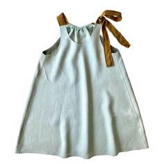 Made to order from light blue linen with adjustable straps. Both sides can be worn as front with 3 different necklines. length : 77 cms + adjustable strap length  width: maximum 110 cms around the bust (adjustable to smaller sizes) Vacation Linen Mini Dress With Tie Back, Linen Mini Dress With Tie Back For Vacation, Spring Linen Mini Dress With Tie Back, Spring Linen Mini Dress With Adjustable Straps, Summer Linen Mini Dress With Adjustable Straps, Light Blue Linen Dress For Spring, Blue Linen Mini Dress For Vacation, Summer Linen Sundress With Tie Back, Spring Sleeveless Linen Suspender Dress