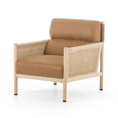 a tan leather and wicker lounge chair on an isolated white background with no people around it