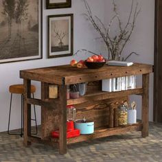 a wooden table topped with books and bowls of fruit next to two pictures on the wall