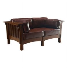 a brown leather couch sitting on top of a wooden frame