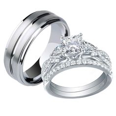 two white gold wedding rings with diamonds on each one and an engagement ring in the middle