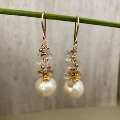 Gorgeous freshwater Pearl Drop Earrings. They are perfect in their simplicity and are incredibly elegant. There is a great deal of detail in these earrings, as you would expect from a Praha Jewelry Design piece. Description: 15mm white round pearls are suspended by 14K GF chain with pastel sapphire briollets. 2mm 14K GF seamless balls sit just above each briollet. All 14K GF and 24K vermeil components Elegant Briolette Earrings With High Luster, Akoya Pearl Drop Dangle Earrings, Classic White Briolette Earrings, Gold Briolette Pearl Earrings With High Luster, Yellow Gold Briolette Pearl Earrings For Wedding, White High Luster Pearl Drop Earrings, Akoya Pearl Drop Earrings In Pearl White, Pearl White Akoya Pearl Drop Bridal Earrings, Akoya Pearl Dangle Earrings For Anniversary