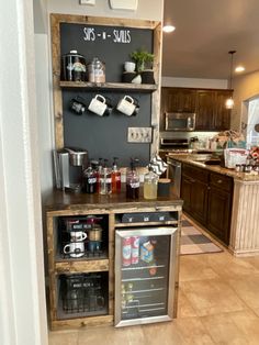 a kitchen area with an open refrigerator and coffee maker