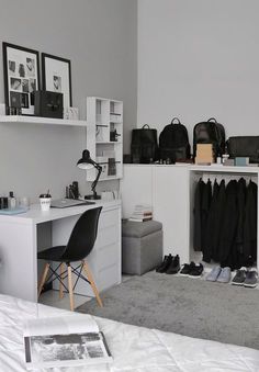 a bedroom with white walls and grey carpet