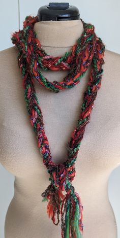 Braided Red and Green yarn scarf can be worn in many ways, even as a belt. Handmade Red Scarf For Fall, Handmade Red Scarves For Fall, Red Scarves For Gifts, Braided Yarn, Yarn Scarf, Green Yarn, Scarf Yarn, Scarf Belt, Scarf Wrap