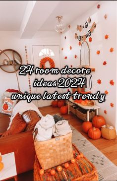 a living room filled with lots of furniture and pumpkins on the floor in front of it