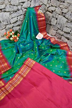 A pure enigmatic collection in golden color with the golden buti and silver zari border, with peacock motif on the pallu and meenakari butta work on spread across the saree in plaintive for, done in the traditional handloom style makes it a classic choice of many. Color: A shade of dual tone blue and green color Technique: Amazing work of golden zari buti work on the body with traditional weaving Fabric: Paithani Quality: Indyvogue's Assurance of Pure Silk Mark Certified Saree Green Raw Silk Traditional Wear With Meenakari, Green Meenakari Raw Silk Traditional Wear, Green Traditional Wear With Meenakari In Raw Silk, Traditional Wear With Meenakari For Diwali Puja, Diwali Traditional Wear With Meenakari For Puja, Traditional Katan Silk Wear With Meenakari For Festivals, Traditional Meenakari Katan Silk Wear For Festivals, Meenakari Katan Silk Traditional Wear For Festivals, Gold Paithani Silk Traditional Wear For Eid