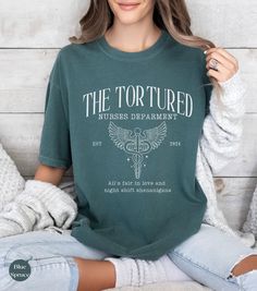 Tortured Nurses Department Shirt, Trending Nurse Shirt,Funny Nurse shirt, NICU shirt, All is fair, RN Tshirts,Nurse Retirement gift, trend PRODUCT DESCRIPTION ✧Gildan garment-dyed Comfort Colors® 1717 t-shirt is 100% cotton  ✧Unisex Adult Sizing ✧Props used in photos are not included with the purchase. PRINT ✧The ink is printed INTO the fabric, not sitting on top of it like vinyl.  SIZE ✧Check your size before ordering ✧The relaxed fit makes it an excellent daily choice ✧Be sure to check the siz Pre-shrunk Crew Neck Nursing Shirt, Casual Nursing Shirt With Crew Neck, Nursing Tops With Text Print And Crew Neck, Crew Neck Nursing Tops With Text Print, Nurse Retirement Gifts, Teacher Tired, Grading Papers, Funny Nurse Shirts, Funny Nurse