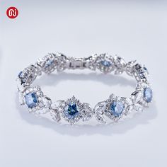 Brand:GIGAJEWE® Product Name:Gigajewe 35.52CT Blue and White Color Moissanite  Bracelets 9K/14K/18K White Gold 136 pieces Cushion and Marquise cut shape Wedding Bracelet Main Stone Material:Moissainte Stone  Shape:Cushion and Marquise cut and Round Cut Color:blue color and White D Color  Stone Weight:cushion:8mm 20ct total,marquise 3.5*7mm and 3*6mm total 9.71ct,round 2.5mm total 5.76ct Total Carat:35.52ct stone quantity:136pieces weight:27.68g Customization:Can select different kinds of gemstone for customization Blue Brilliant Cut Diamond Bracelet For Wedding, Diamond White Brilliant Cut Crystal Bracelet For Wedding, Wedding Crystal Bracelet In Diamond White With Brilliant Cut, Wedding Sapphire Diamond Bracelet With 17 Jewels, Luxury Gemstone Tennis Bracelet For Wedding, Blue Diamond Cut Bracelet For Formal Occasions, Sapphire Diamond Bracelet For Wedding, Formal Blue Diamond-cut Bracelet, Luxury Blue Wedding Bracelets