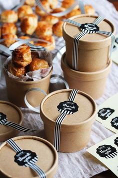 several small containers filled with pastries on top of a table