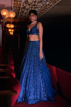 This lehenga set features all over tonal sequin embroidery in a geometric pattern. The ensemble is paired with a strappy blouse and a matching net dupatta.From Seema Gujral’s Night at the Opera collectionDELIVERY TIMEPlease wait 8-12 weeks for your outfit to arrive.FABRIC DETAILSNetProfessional cleaning only. Blue Sequin Lehenga, Sky Blue Lehenga, Lehenga Blue, Royal Blue Lehenga, Strappy Blouse, Sequin Lehenga, Sheer Dupatta, Seema Gujral, Leaf Sleeve