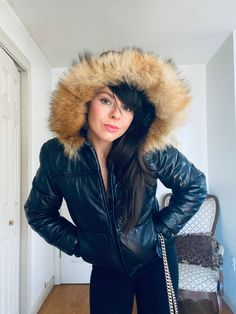 Absolutely the BEST  vintage leather bomber in existence. This 1970s Fox fur trim jacket is in pristine condition. My mother kept it in her closet for the past 40 + years , and it's absolutely perfect.  The black leather is buttery soft and without imperfections or signs of wear. The Fox fur is fluffy and lush . Makes me wonder if my mom ever wore it !!  It's a perfectly petite size Sm / XS .  Gorgeous custom / tailor look     My pops told me he remembers buying it for her before they bought a house together in 1977 . He also remembered paying $650 for it , which at the time was a pretty solid chunk of change.  Well needless to say , It turned out to be a great buy , because they tied the knot and here I am  This jacket for the BIG WIN !! If you have any more questions about this killer bo Winter Leather Jacket With Detachable Hood, Fitted Hooded Leather Jacket With Padded Collar, Fitted Leather Jacket With Padded Collar And Hood, Fitted Leather Jacket With Hood And Padded Collar, Fitted Hooded Fur Coat For Winter, Winter Leather Jacket With Double-lined Hood For Cold Weather, Fitted Leather Jacket With Padded Collar For Winter, Cold Weather Faux Fur Leather Jacket, Fitted Hooded Leather Jacket For Cold Weather