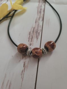 Wooden Bead Necklace.  Boho cord necklace hippy gifts for women birthday gift, ethnic necklace hippie, wooden bead necklace, festival jewellery, bohemian necklace Other styles available  https://www.etsy.com/uk/shop/GillsEnchantedCloset Black Cord with adjustable silver clasp. Comes in organza bag Hippie Adjustable Cord Necklace For Festivals, Unique Handmade Brown Choker, Handmade Brown Bohemian Choker, Bohemian Brown Beaded Choker, Handmade Brown Hippie Necklaces, Adjustable Wooden Beads For Festivals, Brown Wooden Beaded Necklaces For Festivals, Handmade Brown Hippie Necklace, Brown Wooden Beads Jewelry For Festival