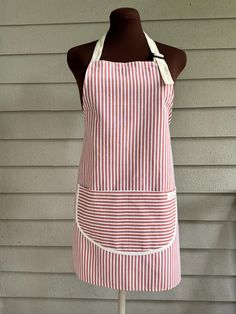 a red and white striped apron on a mannequin