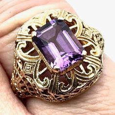 This Antique Vintage 14k Yellow Gold Filigree Purple Amethyst Ring Is A Size 7, Perfect For Women Who Adore Elegance. Its Intricate Design Boasts 4.6 Grams Of 14k Yellow Gold, Making It A Timeless Piece. Antique Vintage Ring 14k Yellow Gold Filigree Purple Amethyst Centerpiece Women's Ring, Size 7 Weighs 4.6 Grams From The Brand "14k Gold" Features: 4.6 Grams, Size 7 Size: Womens 7 Condition: Pre-Owned Like New Vintage And Or Estate Jewelry Items. These Items Are Preowned Items And May Have Been Elegant Purple Amethyst Ring With Filigree, Elegant Purple Amethyst Filigree Ring, 14k Gold Jewelry With Purple Accent Stones, Purple 14k Gold Jewelry With Accent Stones, Formal Purple Amethyst Ring With Filigree, Purple Amethyst Ring With Intricate Design, Fine Jewelry Amethyst Ring Stamped 14k, Antique Purple Amethyst Ring With Intricate Design, Fine Jewelry Amethyst Ring With Intricate Design