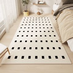 a white rug with black squares on it