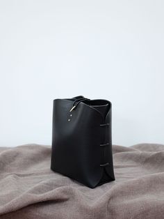 "⚜ Description ⚜ My Brother Makes BAGS, all Hand made French Manufacture in His studio in Burgundy France. You Can buy it here at this price OR BUY LESS expensive directly on His Shop ----> https://www.etsy.com/shop/Anthenay Made of French and Italian aniline vegetable tanned bridle leather from reputable tanneries that source their hides from France. I have the hook closure custom casted from brass in France, and I make the side brass hardware myself from brass plate. The rest of the hardwar Military Rucksack, Black Bucket Bag, Burgundy France, Black Bucket, Brass Plate, Leather Bucket Bag, Denim Bag, Bag Handmade, Vegetable Tanned Leather