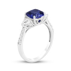 This glimmering blue lab-created sapphire ring makes an unforgettable gift for your special occasion. Sterling silver A cushion-cut blue lab-created sapphire is flanked by trillion-cut white lab-created sapphires Bezel-set round blue lab-created sapphires shimmer on the sides of the setting Round-cut white lab-created sapphires line the tapered shank Blue Radiant Cut Lab-created Sapphire Jewelry, Cushion Cut Lab-created Sapphire Ring, Cushion Cut Lab-created Sapphire Ring In Fine Jewelry Style, Formal Cushion Cut Lab-created Sapphire Ring, Lab-created Sapphire Diamond Ring In Cushion Cut, Sapphire Cushion Cut Ring With Prong Setting, Blue Cushion Cut Sapphire Ring Fine Jewelry, Fine Jewelry Sapphire Cushion Cut Ring, Sapphire Cushion Cut Diamond Ring With Center Stone