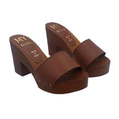 HANDMADE CLOGS wood-effect clogs made in italy -brown leather upper -heel 9 cm + plateau 3 cm -craftsman-made DON'T FORGET TO CHECK THE SIZE BEFORE YOU COMPLETE THE ORDER Size and LENGTH OF THE SHOE ALONG THE CURVE: 36 EU = 5 US = UK 4 = 23.50 CM 37 EU = 6 US = UK 5 = 24.00 CM 38 EU = 7 US = UK5.5 = 24.50 CM 39 EU = 8 US = UK 6 = 25.00 CM 40 EU = 9 US = UK6.5 = 25.50 CM 41 EU = 10US = UK7.5 = 26.00 CM Brown Open Toe Clogs With 4-inch Heel, Brown Wooden Heels With Leather Sole, Brown High Heel Clogs With Wooden Heel, Brown High Heel Mules With Wooden Heel, Brown High Heel Mules With Deep Heel Cup, Brown Open Heel Heels With Deep Heel Cup, Brown Leather Clogs With Padded Heel, Brown Leather Clogs With 4-inch Heel, Brown Wooden Clogs With Wooden Heel