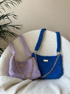 What's your choice, lilac or blue? This crochet bag is so comfy that you will wear it every day. The crochet strap makes it an easy crossbody bag to wear all day long. You also have a little curb chain, so you can remove the big strap if the night arrives and you prefer a more chic and compact shoulder bag. If you would love to have this bag model in other colors, write us: contact@jeleja.com   Handmade bag: crochet technique on the bag and on the strap; recycled cotton (lilac or blue); curb cha Easy Crossbody Bag, Blue Crochet Bag, Crochet Lilac, Crochet Strap, Bag Model, Handmade Bag, Bag Crochet, Crochet Bags, Crochet Techniques