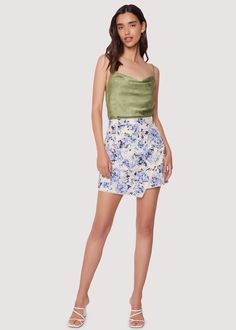 Looking for the perfect addition to your wardrobe? Look no further than our Light Of Iris Mini Skirt! The eyelet and blue floral print provide a touch of elegance, while the lace trim adds a delicate touch. With its high waisted and overlap style, it can be paired with a satin top or your favorite tee for a versatile and stylish look. Style #WSWC06269 Imported 100% Cotton Model is 5 ft 11 inches; Bust: 32", Waist: 23.5", Hips: 35" and wearing a size Small Runs true to size Hand wash cold, Air dr Blue Floral Print, Satin Top, Swim Accessories, Cold Air, Short Rompers, Skirts For Sale, 11 Inches, Air Dry, Blue Floral