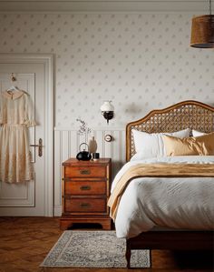 a bed sitting next to a dresser in a bedroom