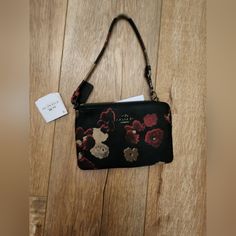 Nwt Coach Large Gold/Midnight Corner Zip Wristlet Black Dreamy Land Floral Print Evening Rectangular Wristlet With Wrist Strap, Chic Evening Bag With Wrist Strap, Evening Bags With Wrist Strap, Evening Clutch Wristlet, Evening Pouch With Adjustable Strap, Black Wristlet For Evening, Elegant Multicolor Wristlet For Everyday Use, Party Wristlet With Wrist Strap, Coach Clutch Bag With Wrist Strap