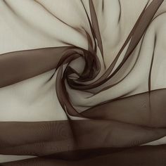 Solid Brown Crystal Organza Fabric by the yard, bulk or wholesale.  Delicately sheer, lightweight, and incredibly soft to the touch, it's the ideal choice for a wide range of projects. Our Brown Organza fabric is perfect for creating exquisite garments and decorations.  Crafted from 100% polyester, this lightweight fabric offers a sheer and crisp drape, providing strength and elegance in every project. Organza is the ideal choice for achieving voluminous and structural effects, whether you're designing ball gowns, wedding dresses, blouses, scarves, bridal apparel, or fabric roses. This brown organza fabric is also perfect for event decorations. Whether it's for apparel or wedding decorations, the sheer beauty of this organza fabric adds a captivating touch to any setting.  Product Details: Ceiling Draping, Event Decorations, Fabric Roses, Future Bride, Organza Fabric, Bridal Outfits, Fashion Fabric, Twinkle Twinkle, Event Decor