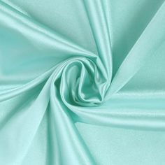 Stretch charmeuse satin fabric is composed of 97% polyester and 3% lycra with a 56/58 width. This lightweight fabric has smooth and silky to the touch. It has a tightly knit weave and slight 2-way vertical stretch, making it extremely versatile in application. The combination of these characteristics create and elegant flow when used for draping. This fabric has a beautiful shiny satin side with a modest matte finish on the back, allowing for a very elegant and high-end look. This fabric is perf Stretch Satin Fabric, For Wedding Dress, Stretch Satin, Green Satin, Blue Satin, Tiffany Blue, Fabric Shop, Dress Ideas, Sewing Fabric