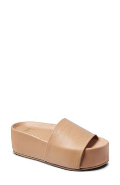 A wrapped platform adds eye-catching sleekness to this slide sandal made from vegetable-tanned leather and cushioned with plush memory foam. The molded footbed will provide arch and overall foot support. Memory foam cushioning Leather upper and lining/rubber sole Imported Comfortable Open Toe Platform Slides, Modern Open Toe Platform Slippers With Textured Footbed, Spring Comfortable Platform Slippers With Leather Footbed, Comfortable Leather Footbed Platform Slippers For Spring, Chic Platform Slippers With Leather Footbed, Leather Round Toe Platform Slippers For Vacation, Leather Slip-on Platform Slippers For Vacation, Comfortable Leather Platform Slippers With Cushioned Footbed, Modern Platform Slide Slippers With Cushioned Footbed