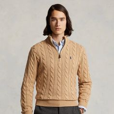 This chunky-knit cotton layer features our iconic cable design and signature embroidered Pony. Classic Cotton Cable Knit Outerwear, Classic Cable Knit Cotton Outerwear, Classic Cotton Cable Knit Sweater, Spring Wool Cable Knit Sweater, Brown Cotton Cable Knit Sweater, Brown Cable Knit Cotton Sweater, Ralph Lauren Classic Spring Sweater, Ralph Lauren Classic Fall Sweater, Classic Ralph Lauren Sweater For Spring