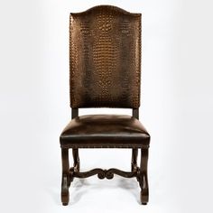 a brown leather chair sitting on top of a white floor next to a wooden frame