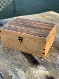 a wooden box sitting on top of a table